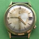 3 gold numerals, gold hands, gold 5 min and minute markers date window and black numerals