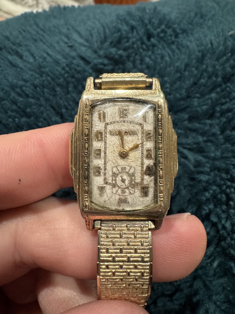 Face of the watch showing art deco style and small second hand