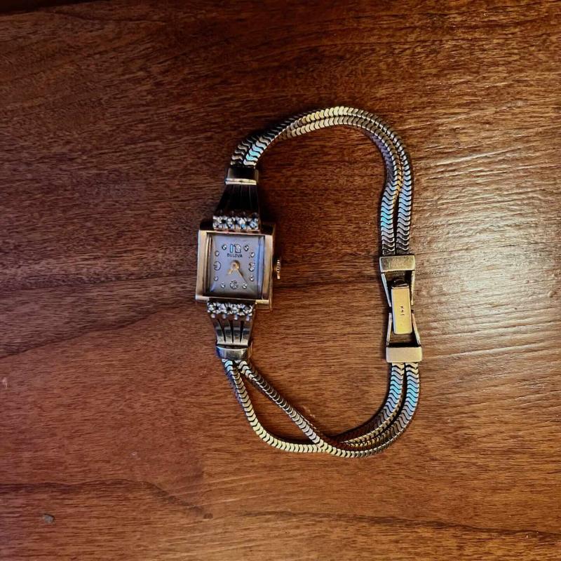 Gold Bulova watch, square face