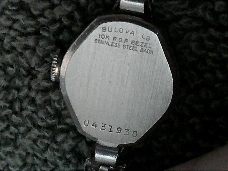 Stainless Steel watch case back with engraved letters and numbers