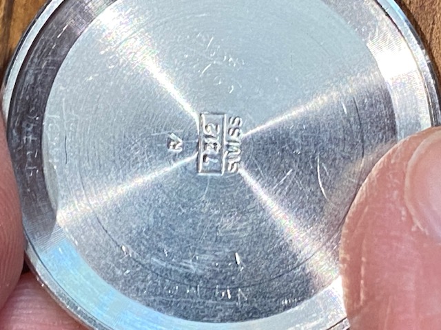 7212 is written inside the caseback