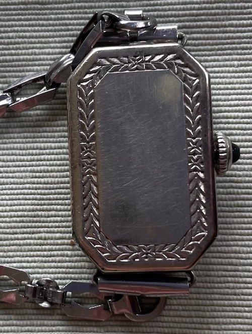 tall rectangle-shaped back of watch, white gold