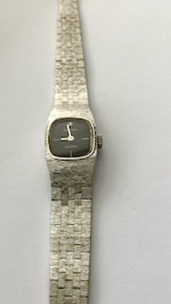 Bulova ladies watch with black dial with single diamond and bark effect integrated strap 040826 - front