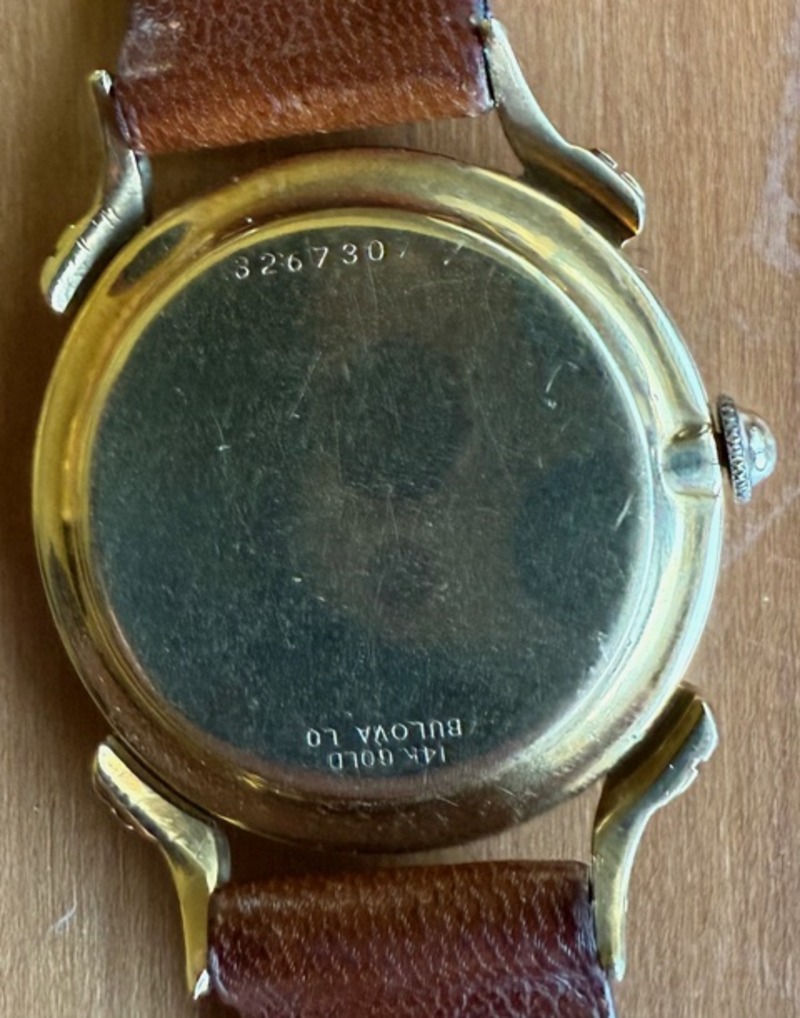 Back of case.  It states that it is 14K gold