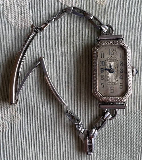 tall rectangle shaped watch with chain bracelet and long metal clasp
