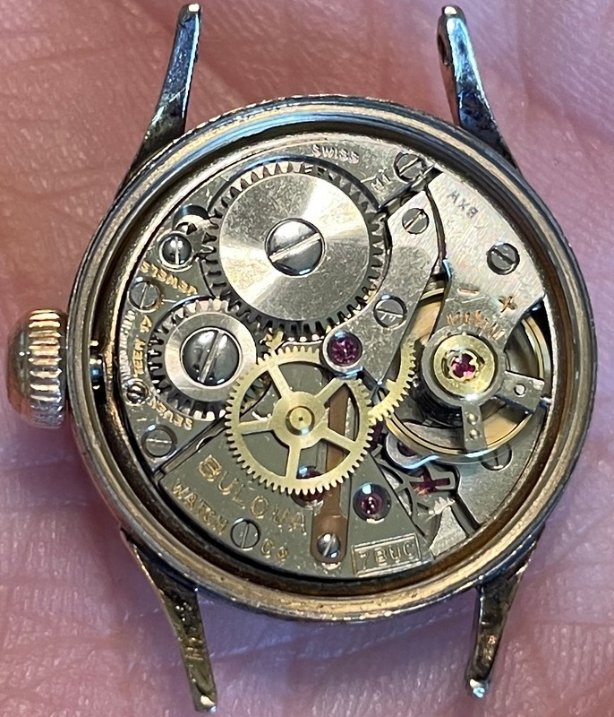 Inside of movement with “seventeen 17 jewels” “Swiss” “Bulova Watch Co.” “7BUC” “M1”