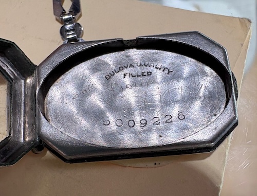 inside of watch case, with serial number