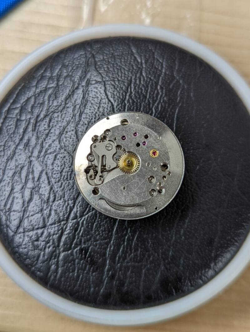 Dial side of movement.