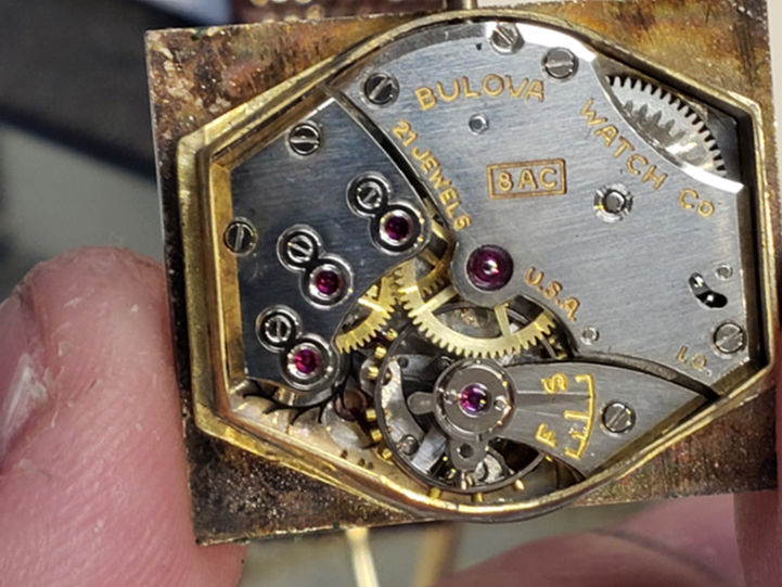 Movement of the watch. Marked L0 & 8AC 21 jewels.